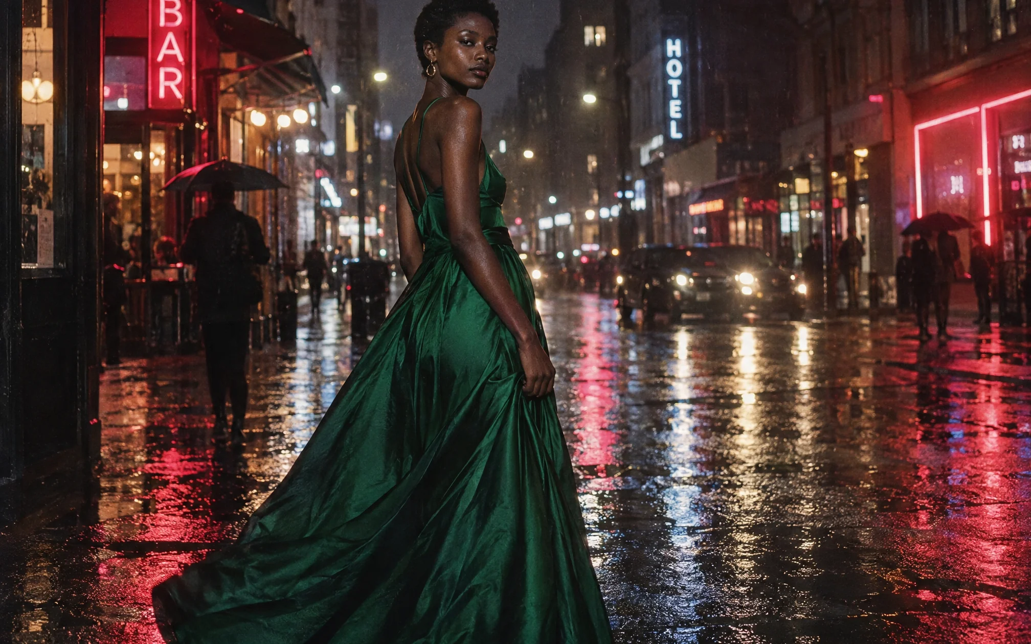 Fashion model in emerald gown on rain-soaked city street